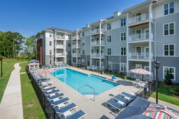 Outdoor saltwater pool with poolside lounging